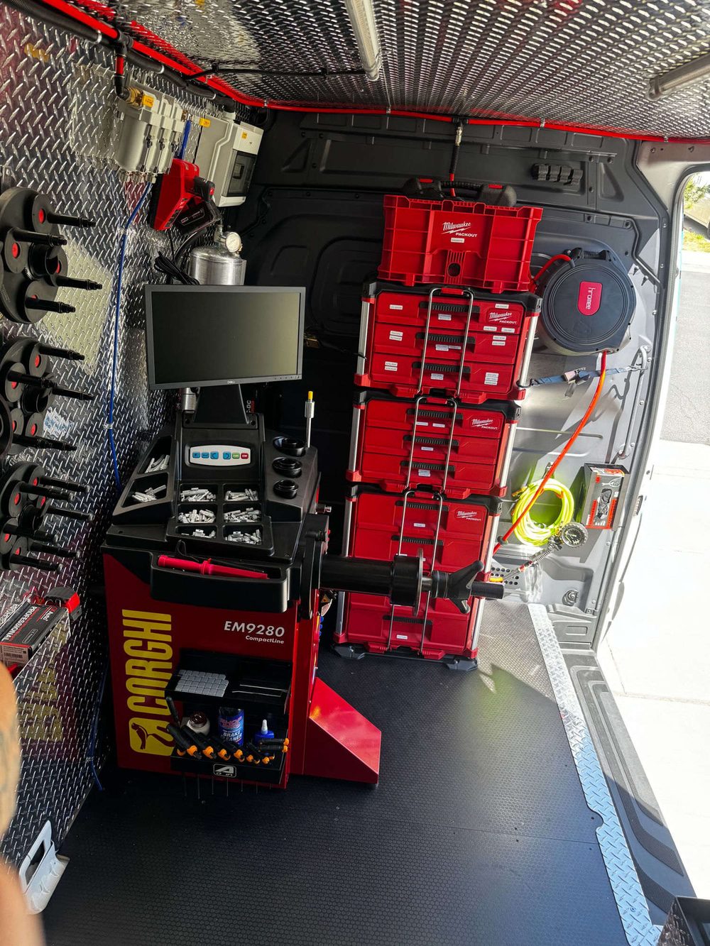 Fully equipped Grip Mobile Tire service van with wheel weight storage and battery tools